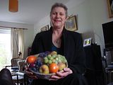 Anne Chapman with a gift of fruit