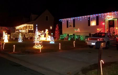 Neighbors This house has the most decorations on the street. Her trees play music.