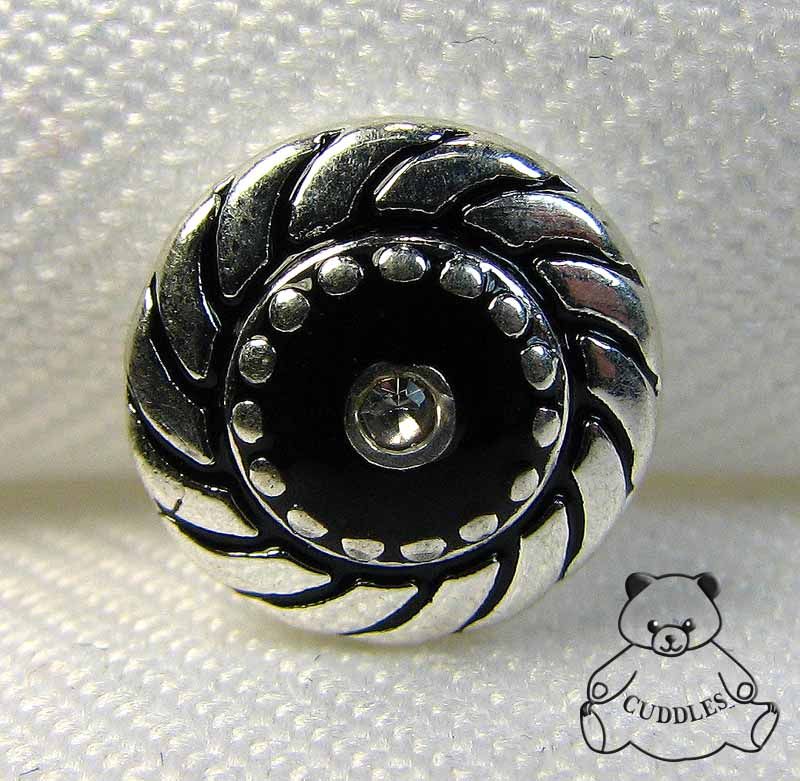 black swirl charm made by lottie dotties